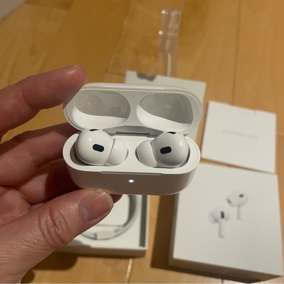 Apple Airpods 2nd Gen. USB-type C charger and extra ear pieces included.